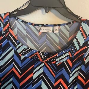 Blue striped top with 3/4 sleeve, scooped neck line stitched and embezzled